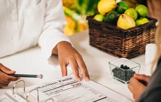 A nutritionist explaining nutritional value to a client